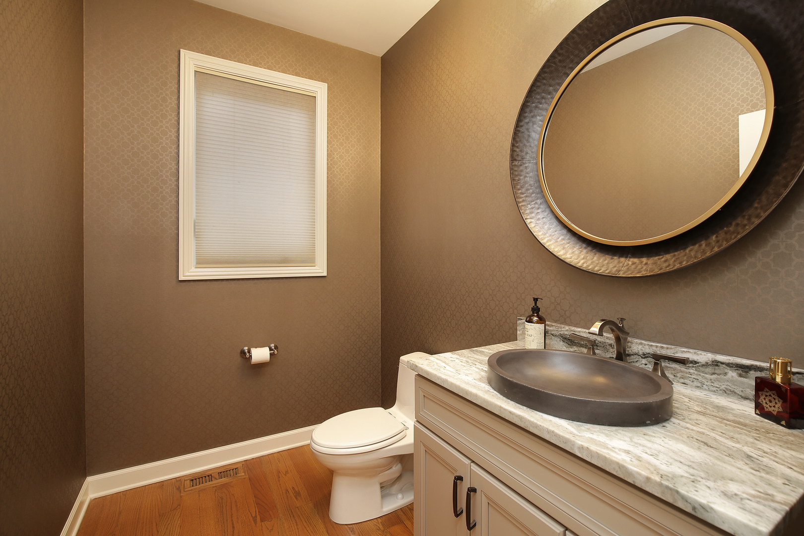 78 Ronan Road Highwood, IL 60040 - Photo 12 of 27 a bathroom with a toilet a sink and mirror