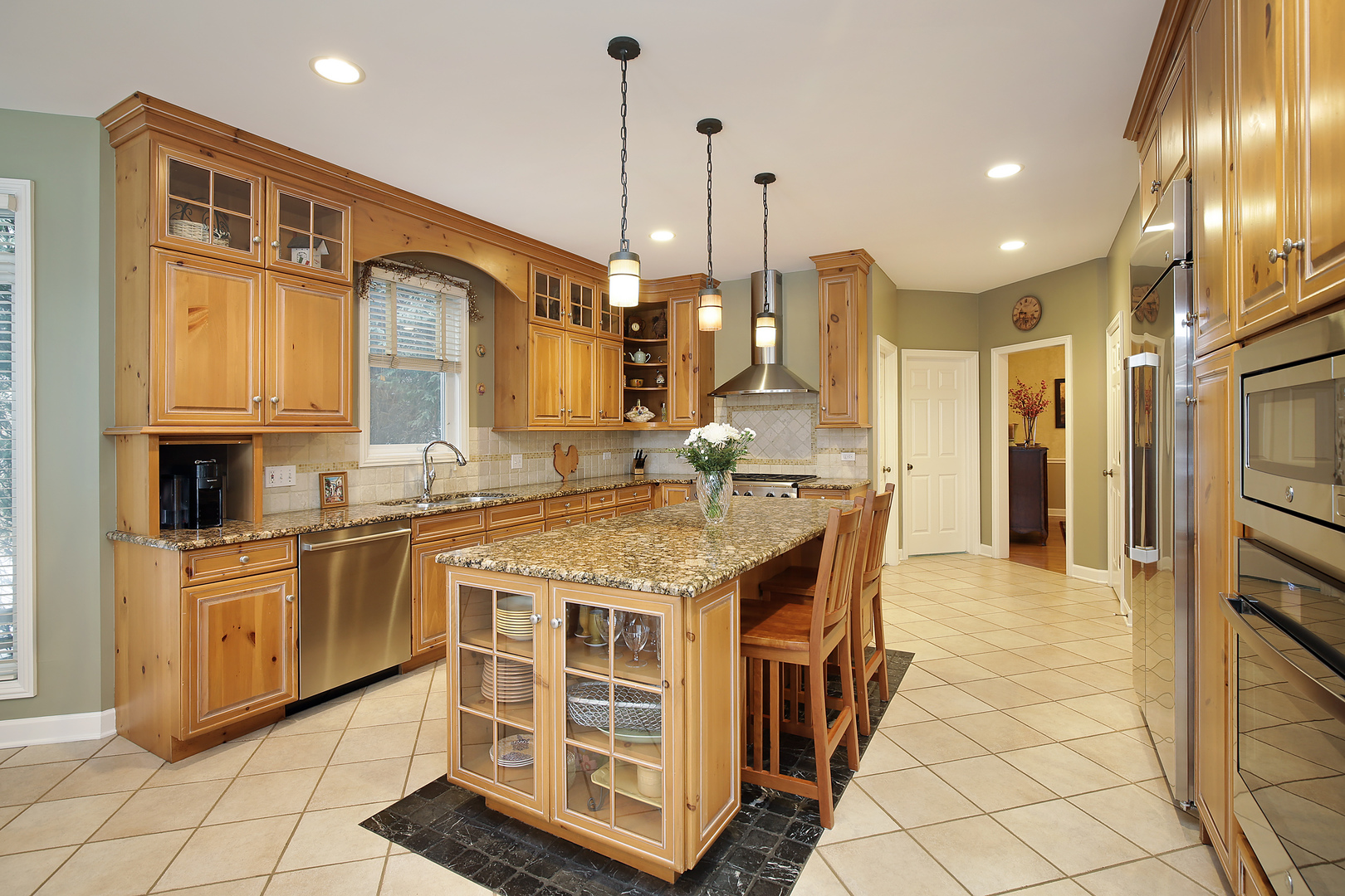 78 Ronan Road Highwood, IL 60040 - Photo 6 of 27 a kitchen with stainless steel appliances granite countertop a sink a stove and a refrigerator