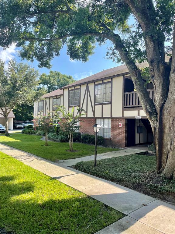 5335 Hansel Avenue, Unit 8 Edgewood, FL 32809 - Photo 1 of 1 a front view of house with yard and green space