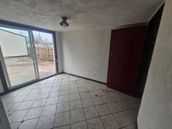 a view of an empty room with a window