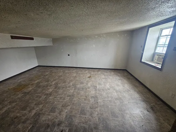 an empty room with windows