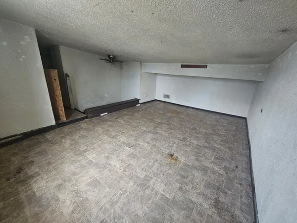 an empty room with a hallway