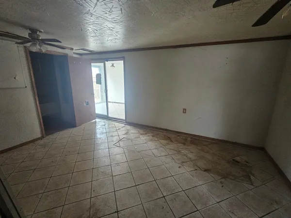 a view of an empty room and window