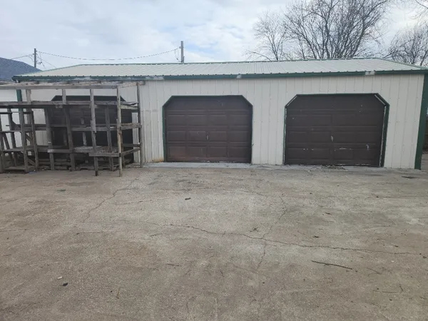 a view of an empty room with a sink and garage