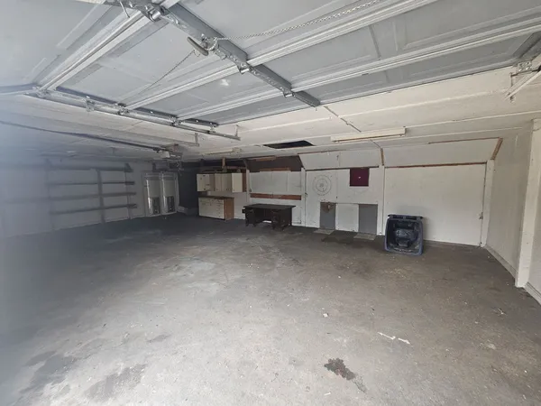 a view of empty room with wooden ceiling