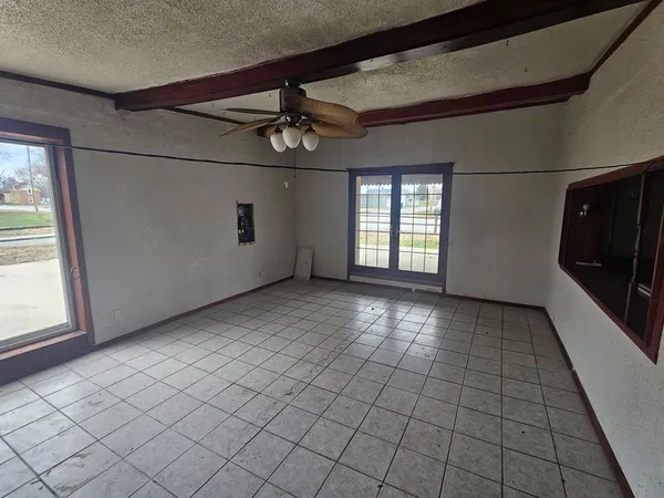 a view of an empty room and window