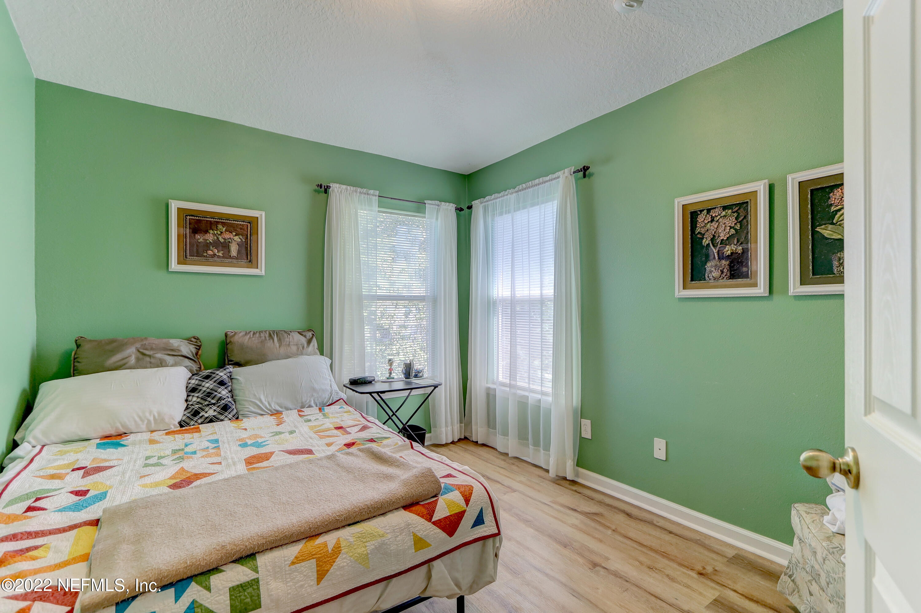 12952 Spring Rain Road Jacksonville, FL 32258 - Photo 20 of 28 a bedroom with a bed and a window
