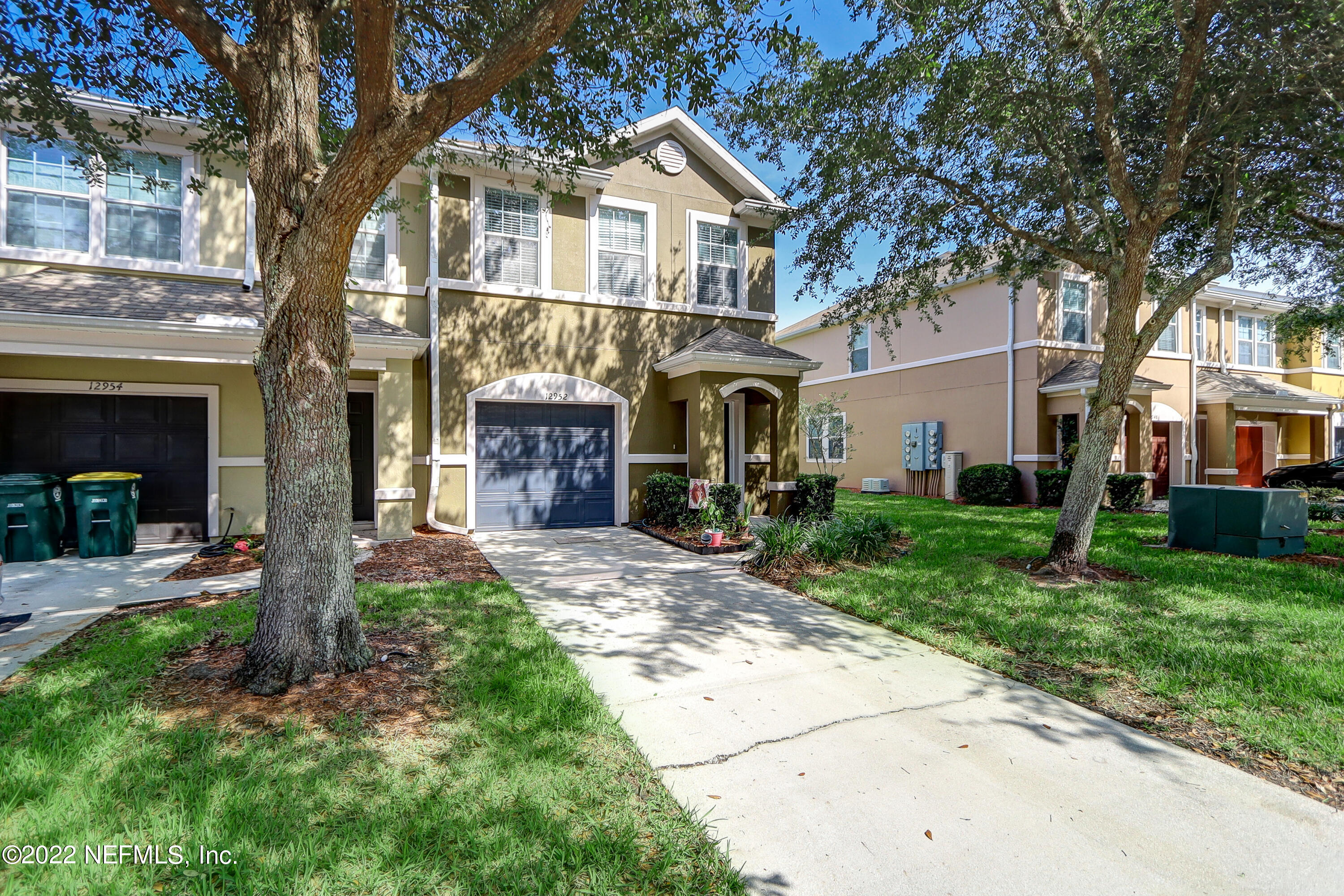 12952 Spring Rain Road Jacksonville, FL 32258 - Photo 2 of 28 a front view of a house with a yard and garage