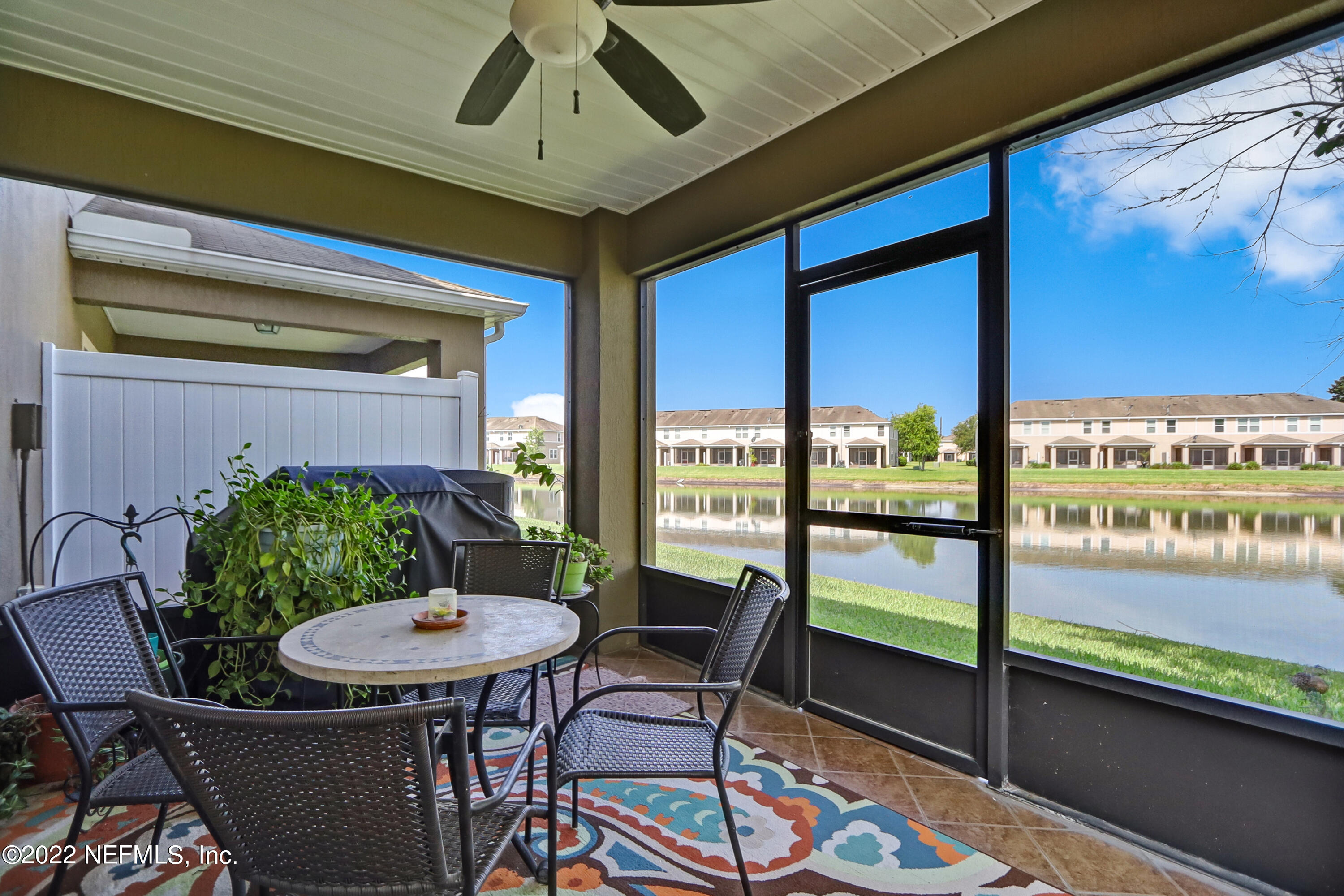 12952 Spring Rain Road Jacksonville, FL 32258 - Photo 26 of 28 a view of a dining room with furniture window and wooden floor