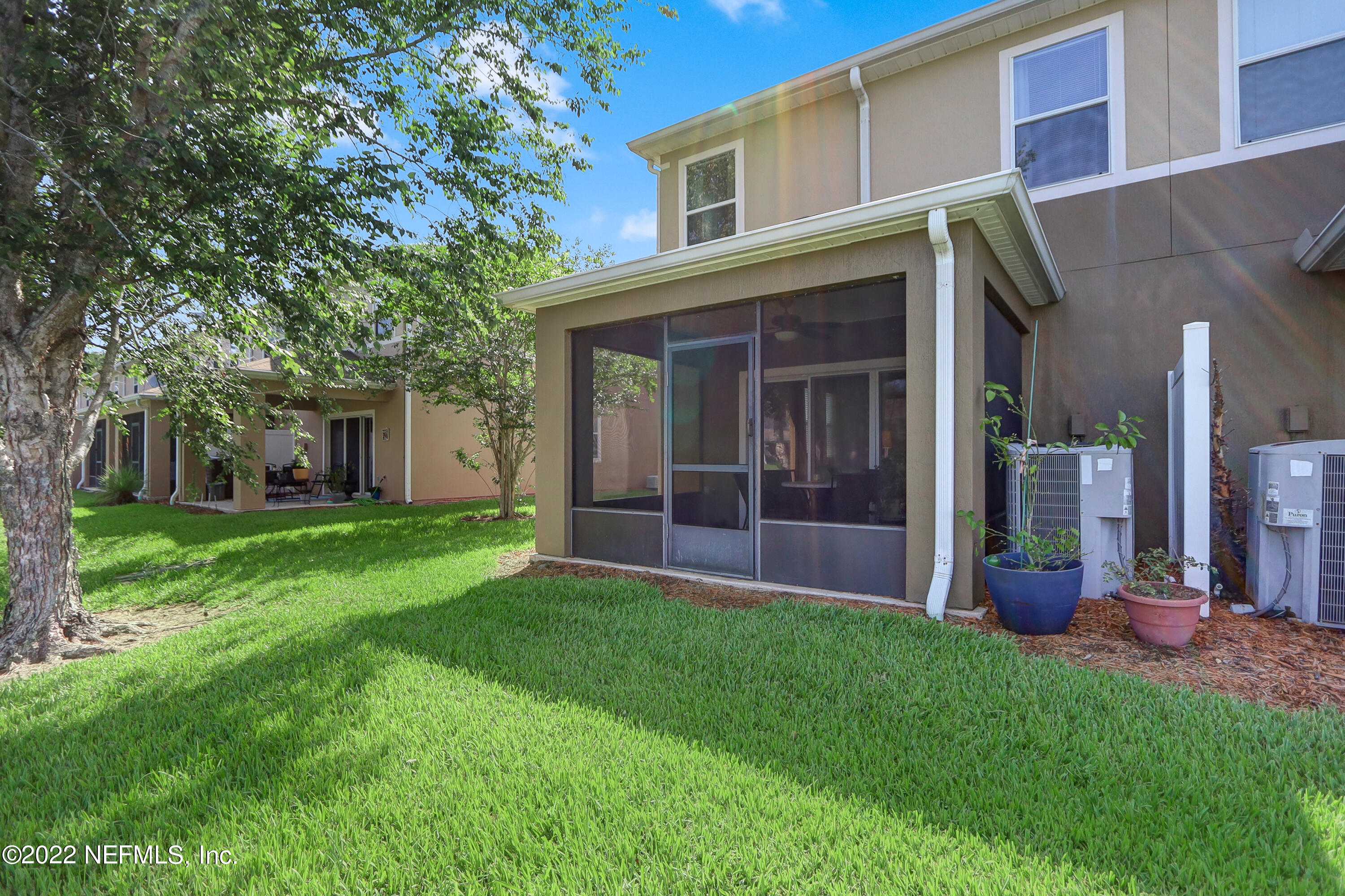 12952 Spring Rain Road Jacksonville, FL 32258 - Photo 27 of 28 a view of a house with a yard and tree