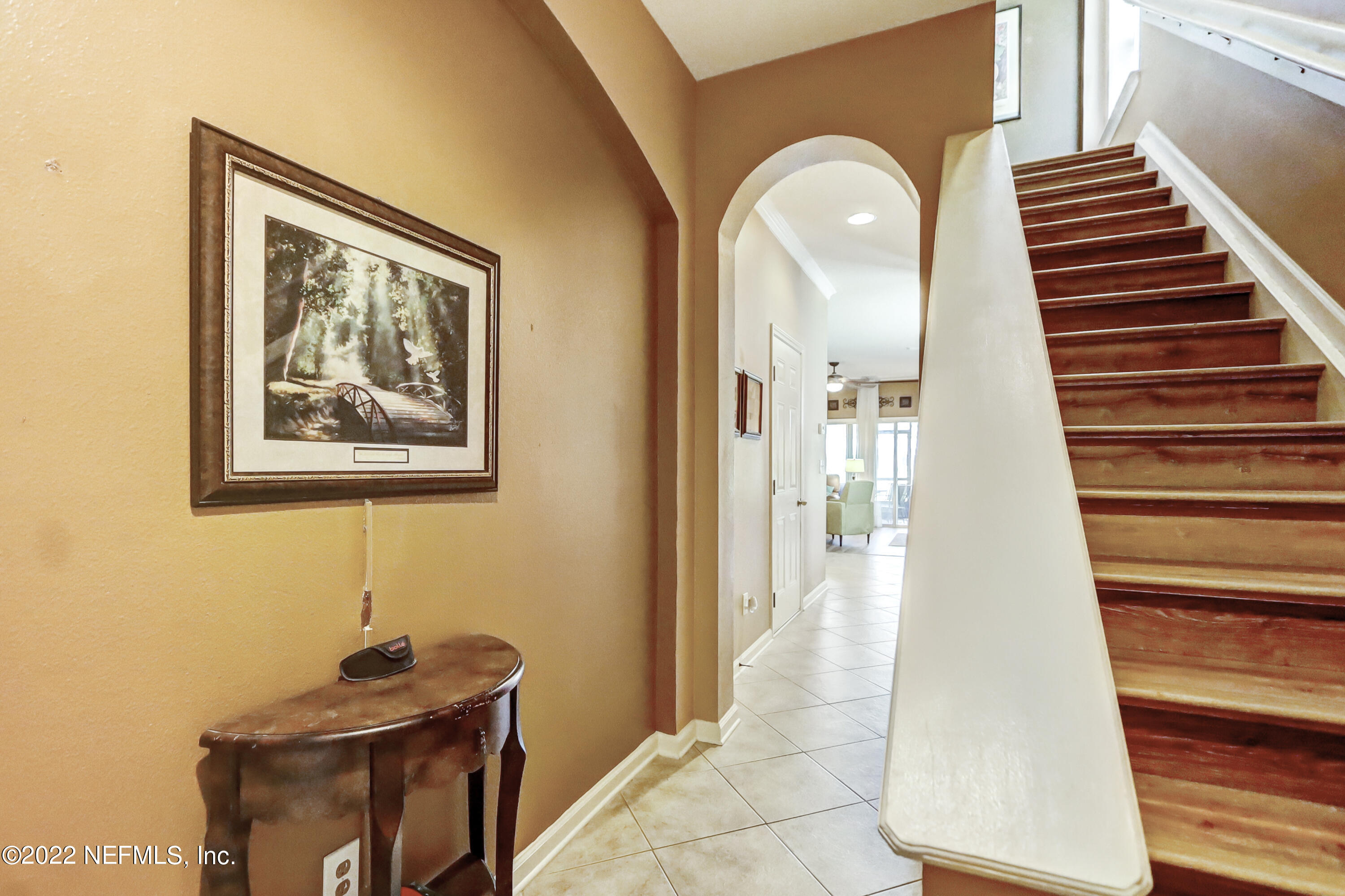 12952 Spring Rain Road Jacksonville, FL 32258 - Photo 5 of 28 a view of a hallway with entryway wooden floor and front door