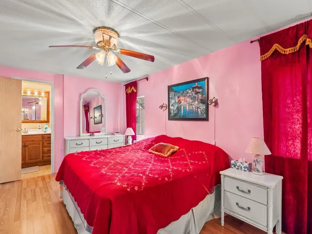 a bedroom with a bed and a dresser