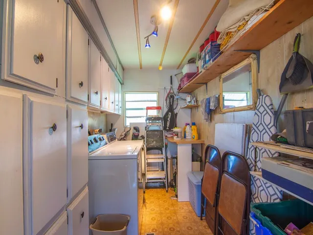 a view of living room with furniture and a fireplace