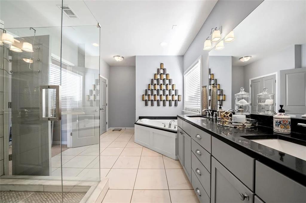 3165 Oakdale Road Atlanta, GA 30354 - Photo 24 of 35 a large kitchen with a large counter top a sink a refrigerator and cabinets