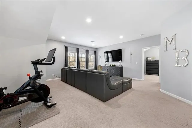 a view of a livingroom with furniture and a flat screen tv