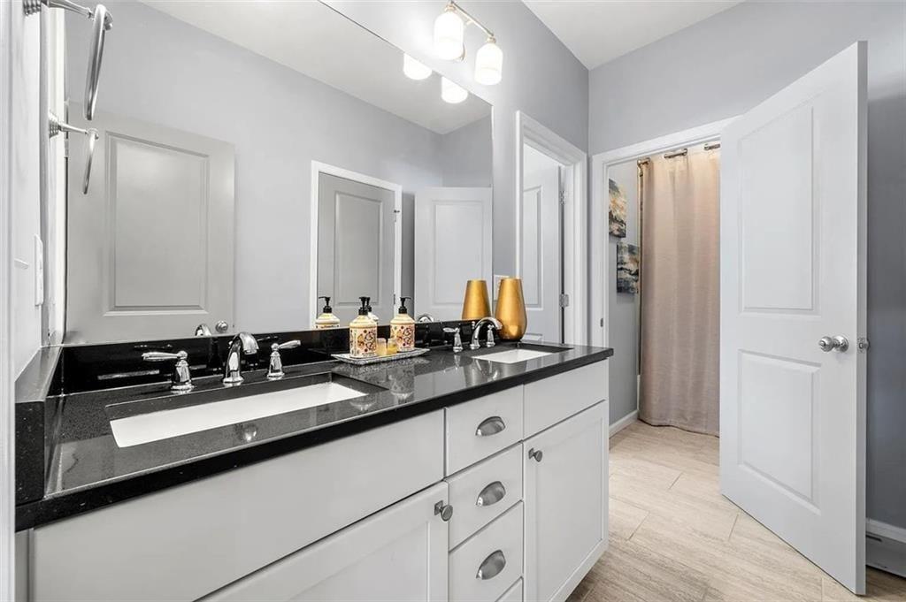 3165 Oakdale Road Atlanta, GA 30354 - Photo 28 of 35 a bathroom with double sink and a mirror