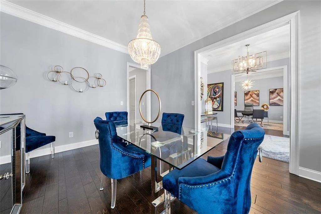 3165 Oakdale Road Atlanta, GA 30354 - Photo 31 of 35 a view of a dining room with furniture wooden floor and chandelier