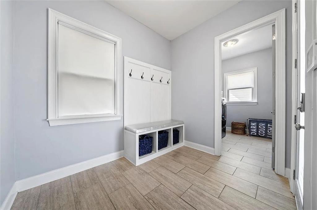 3165 Oakdale Road Atlanta, GA 30354 - Photo 32 of 35 an empty room with wooden floor and mirror