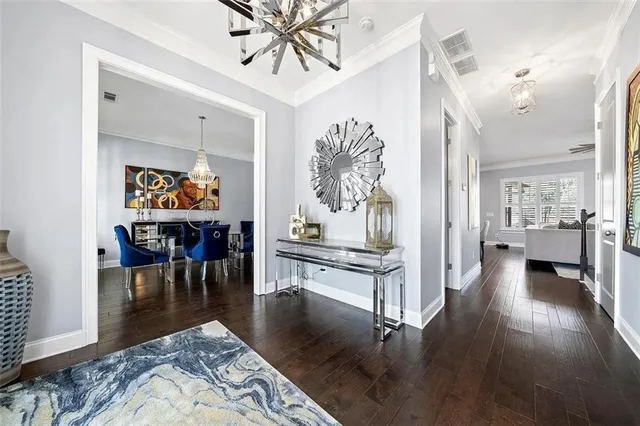 a living room with fireplace furniture and a wooden floor