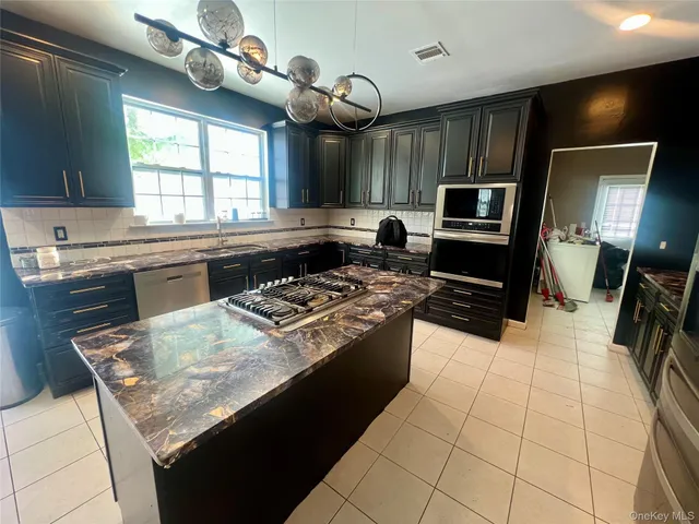 a bathroom with a sink mirror and vanity