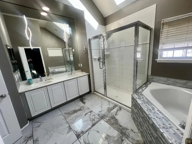 a bathroom with a sink and a shower