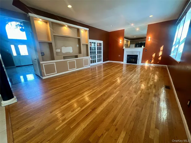 a view of a room with wooden floor