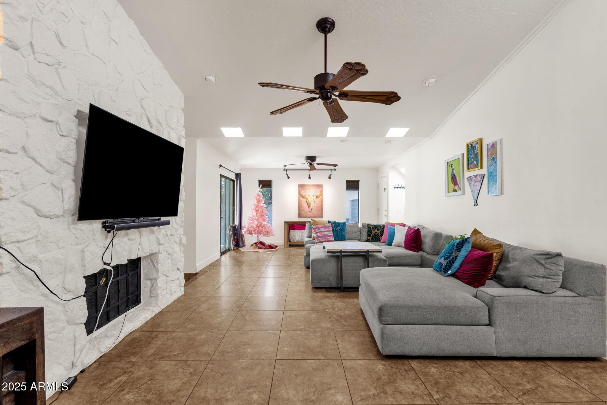 89 North Riata Street Gilbert, AZ 85234 - Photo 10 of 40 a living room with furniture and a flat screen tv