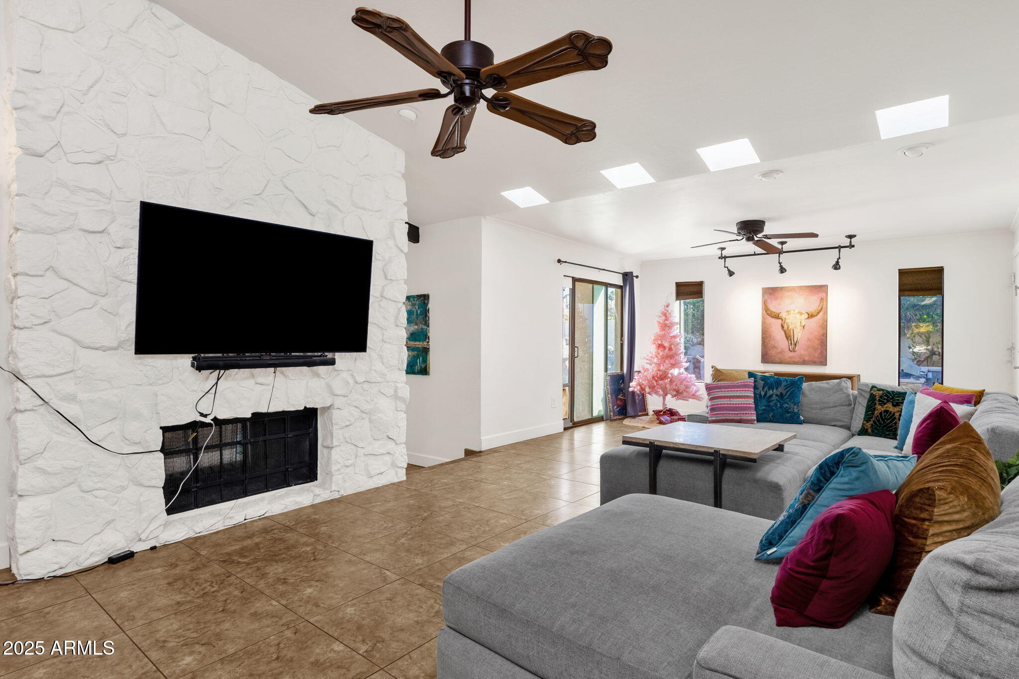 89 North Riata Street Gilbert, AZ 85234 - Photo 11 of 40 a living room with furniture and a flat screen tv