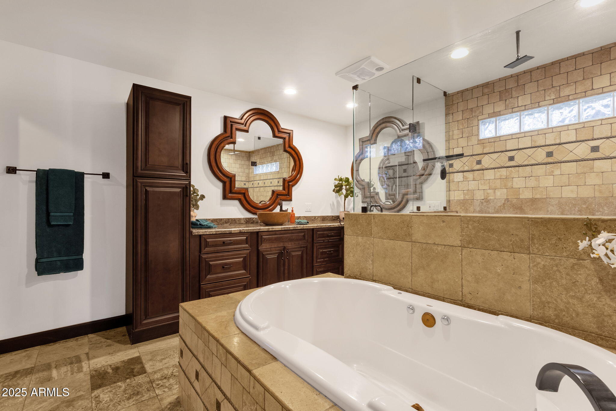 89 North Riata Street Gilbert, AZ 85234 - Photo 21 of 40 a bathroom with a tub sink and mirror