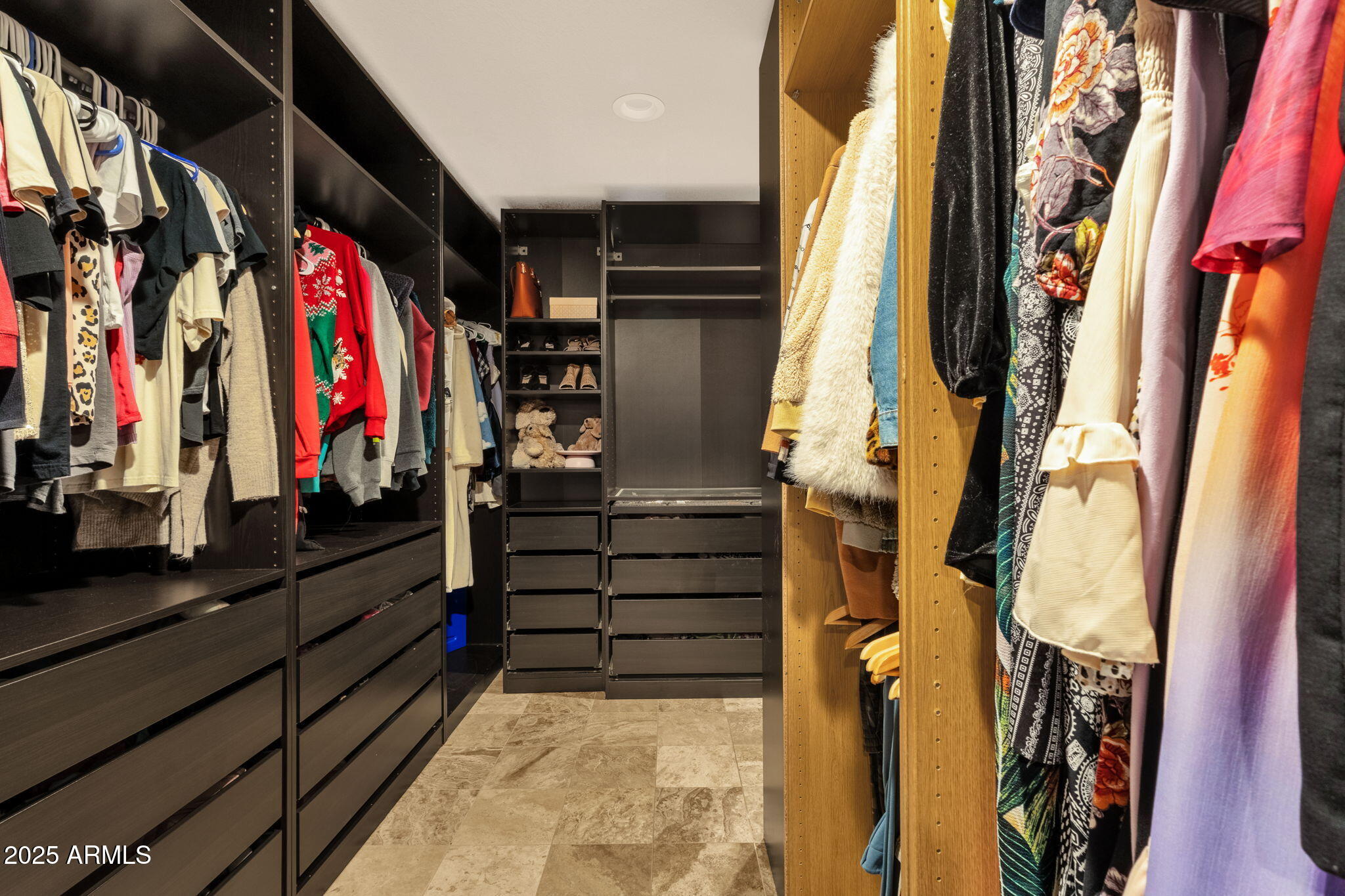 89 North Riata Street Gilbert, AZ 85234 - Photo 22 of 40 a view of walk in closet with clothes