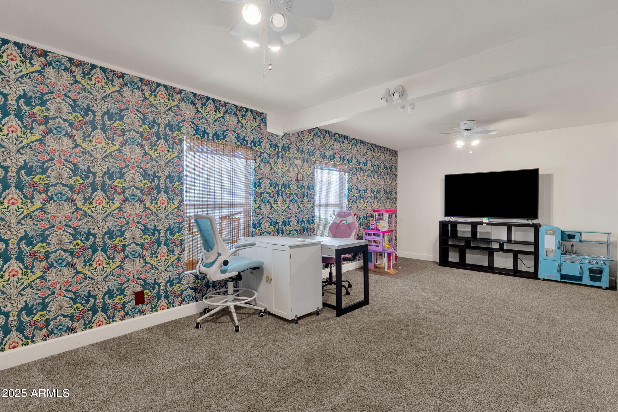 89 North Riata Street Gilbert, AZ 85234 - Photo 31 of 40 a view of a livingroom with furniture and a flat screen tv