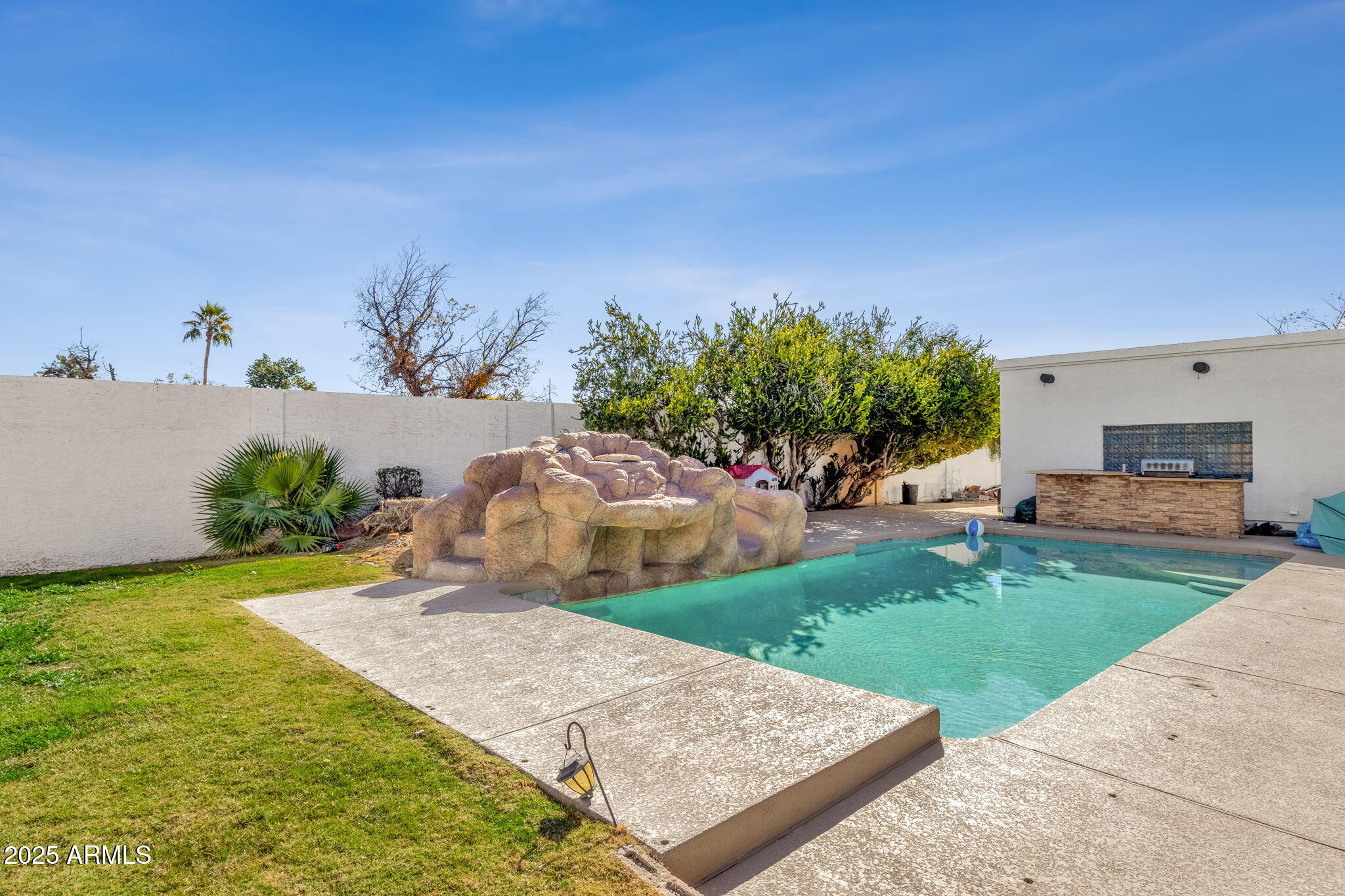 89 North Riata Street Gilbert, AZ 85234 - Photo 35 of 40 a view of a backyard with a garden and entertaining space