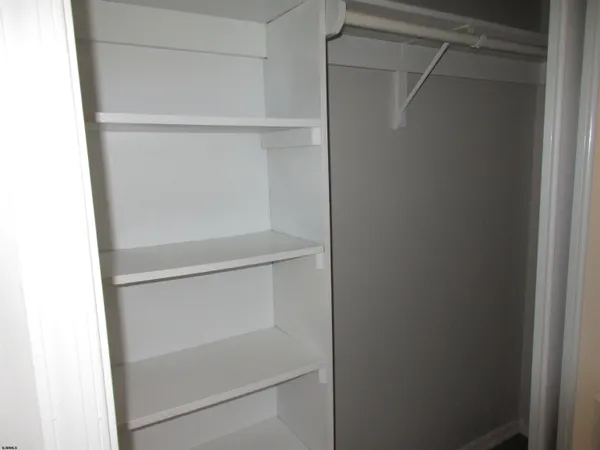 a view of an empty walk in closet