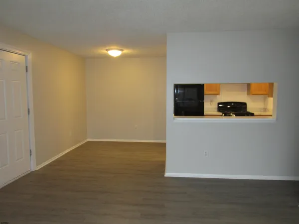 a view of a flat screen tv with wooden floor