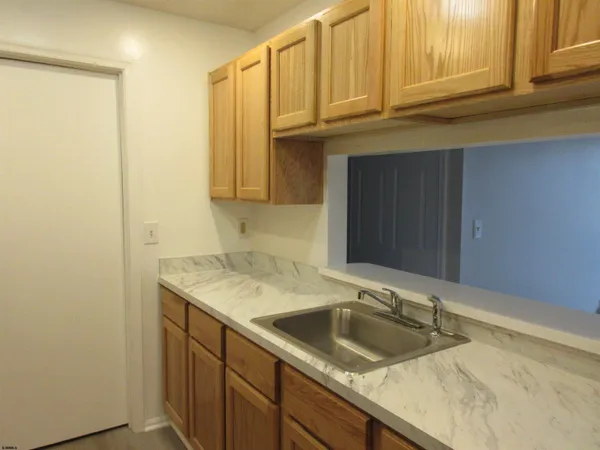 a bathroom with a sink and cabinets