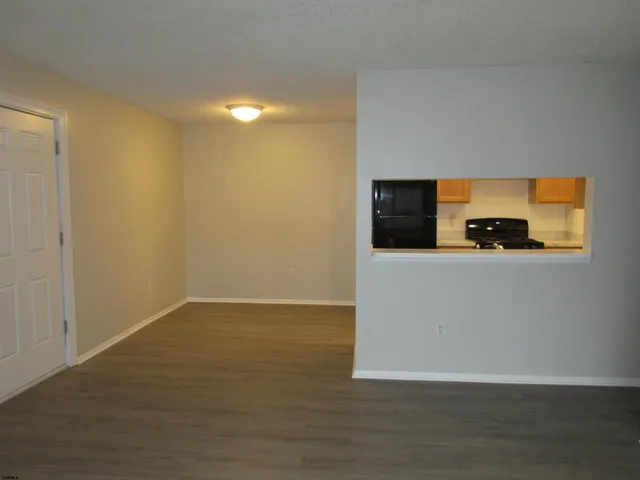 a view of a flat screen tv with wooden floor
