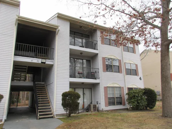 a front view of a house with a garage