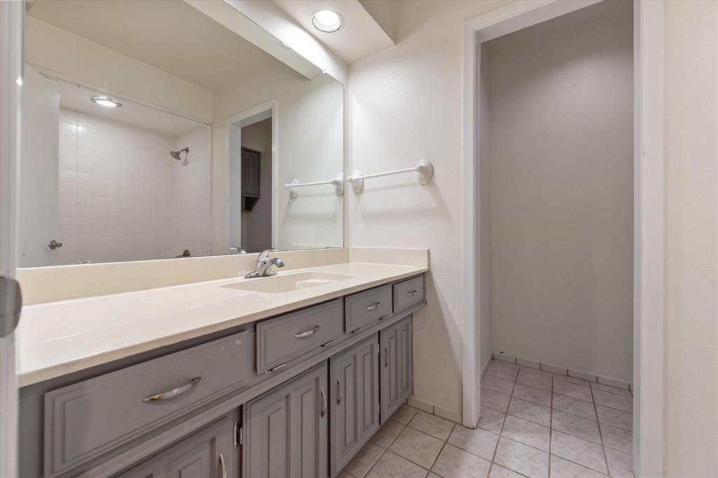 1036 Clinton Street Carrollton, TX 75007 - Photo 28 of 40 Full bathroom featuring light tile patterned floors, vanity, recessed lighting, and a shower