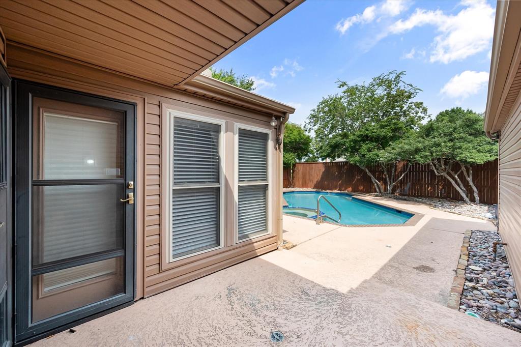 1036 Clinton Street Carrollton, TX 75007 - Photo 32 of 40 View of pool featuring a fenced backyard and a patio area