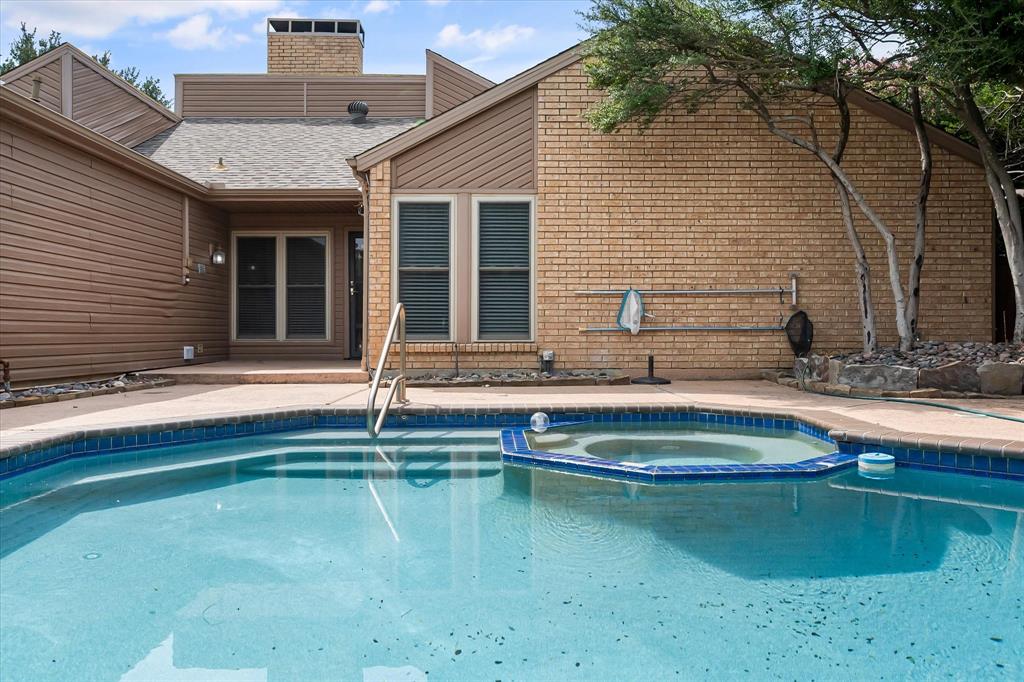 1036 Clinton Street Carrollton, TX 75007 - Photo 34 of 40 View of swimming pool featuring a patio area and a pool with connected hot tub