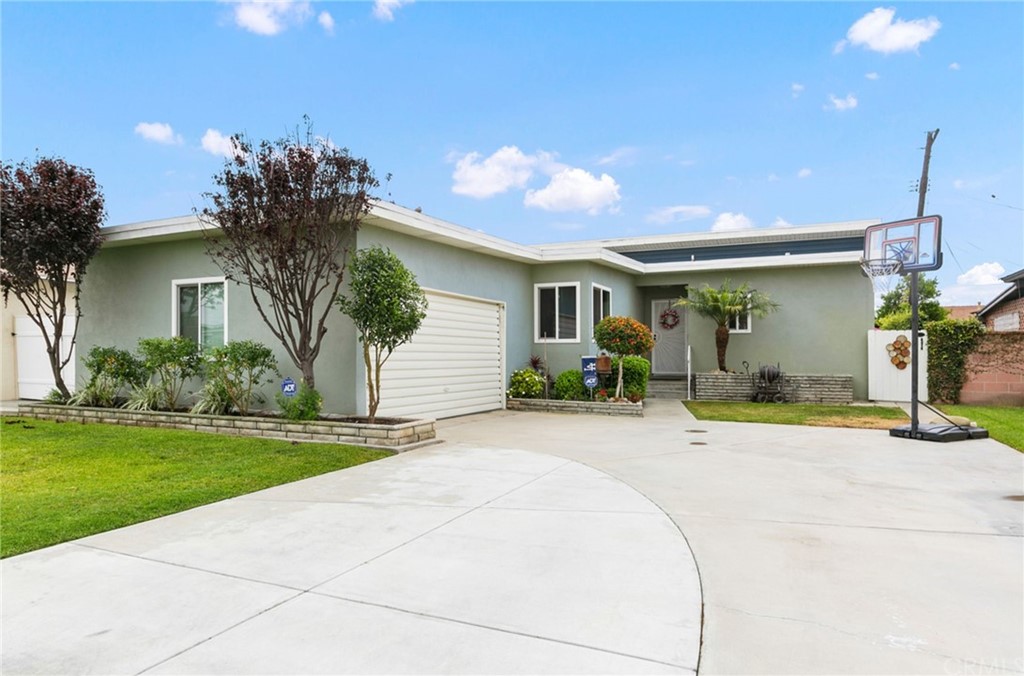 6108 Wolfe Street Lakewood, CA 90713 - Photo 1 of 1 a front view of a house with garden