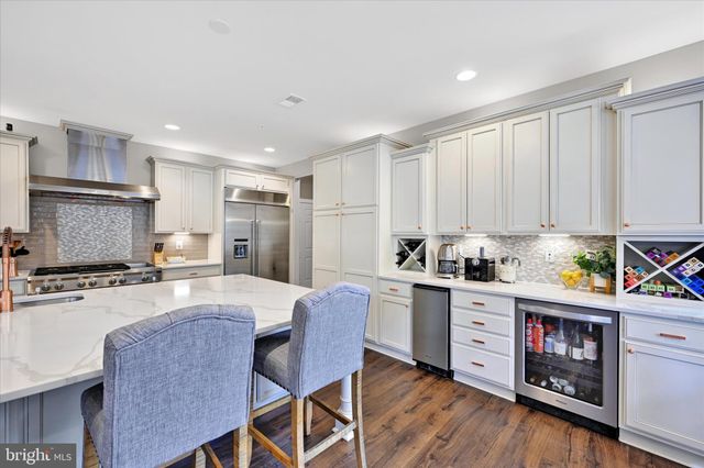 a bathroom with a sink a toilet a mirror and vanity