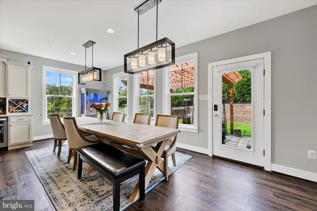 a living room with furniture a rug and a window