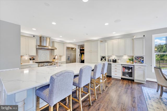 a view of entryway with wooden floor and stairs