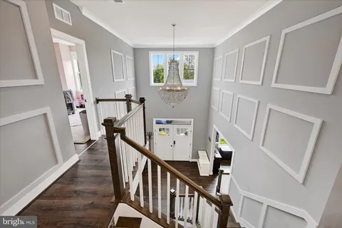 a spacious bedroom with a bed and a flat screen tv