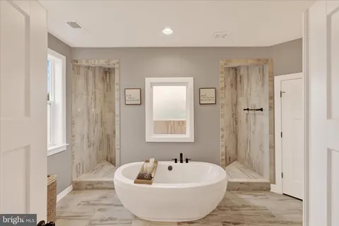 a living room with furniture a rug and a window