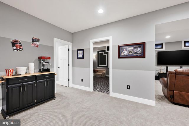 a car parked in front of a white house