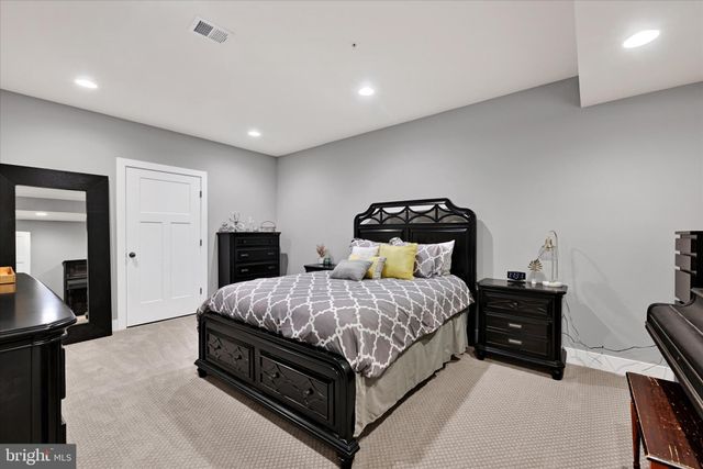 a view of a patio with a table and chairs next to a yard