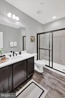 an aerial view of multiple houses with a yard