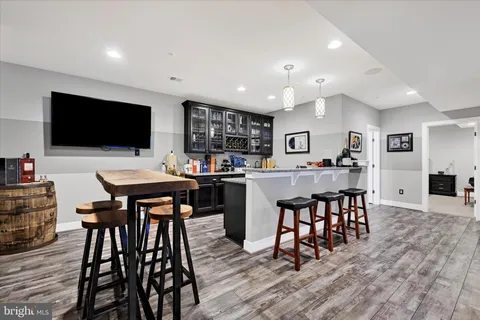 an aerial view of a house with a garden and swimming pool